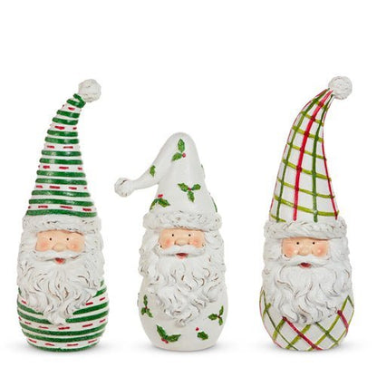 Three decorative gnomes with colorful hats on a white background