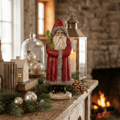 Decorative Santa figure on a mantel with Christmas decorations and a fireplace in the background