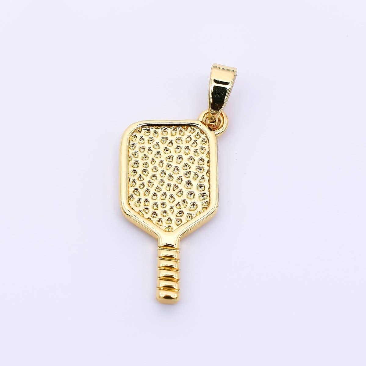 Gold pickleball paddle pendant on a white background