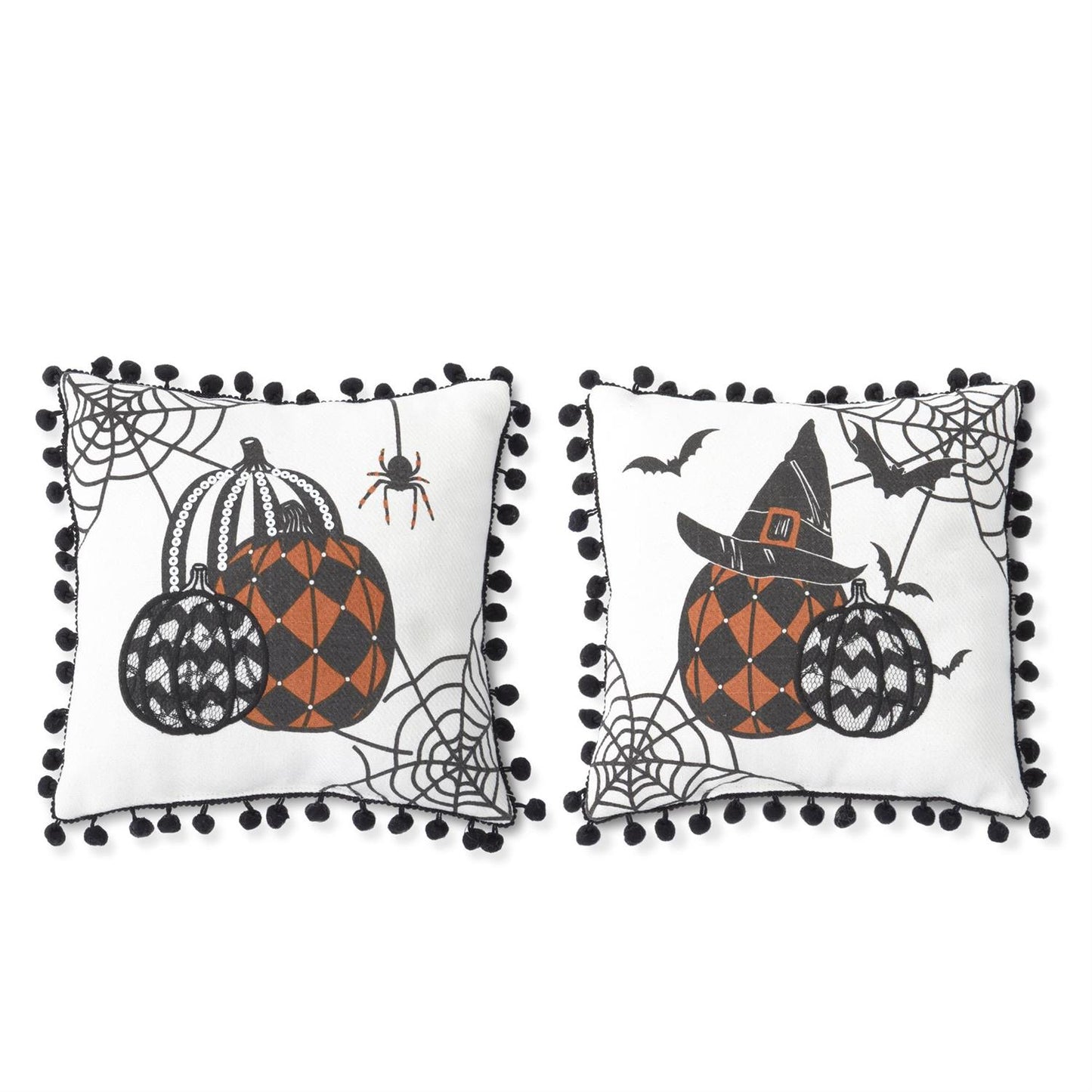 Two square white decorative throw pillows with black pom-pom trim, featuring Halloween-themed illustrations of patterned pumpkins, spiderwebs, a spider, bats, and a witch hat on a white background.