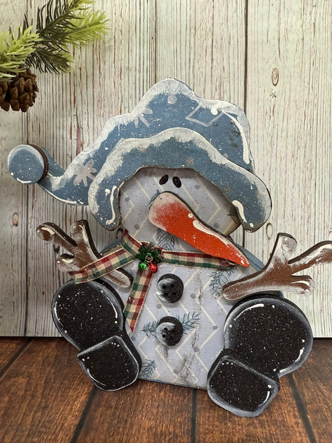 Whimsical Sitting Snowman    