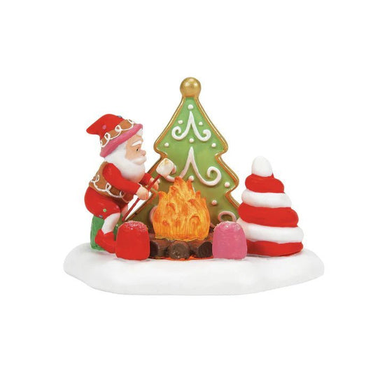 Decorative Christmas scene with Santa Claus, gingerbread house, and cookies on a white background