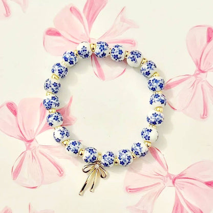 Blue Bracelet with Floral Porcelain Bow Charm, Stylish Wristwear for Elegant Everyday Look, Perfect Gift for Her - Nifty Decor & More