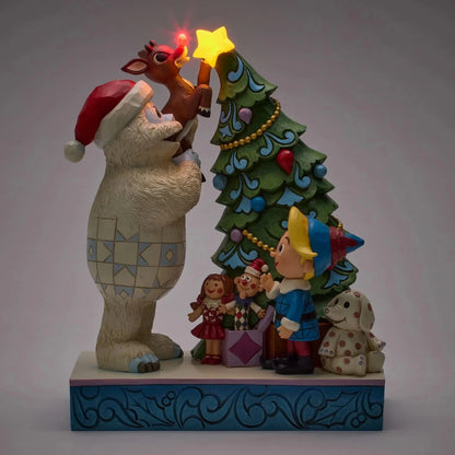Bumble Holding Rudolph by Tree - Nifty Decor & More