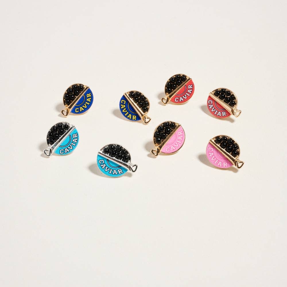 Set of 'Caviar' themed jewelry pieces on a white background
