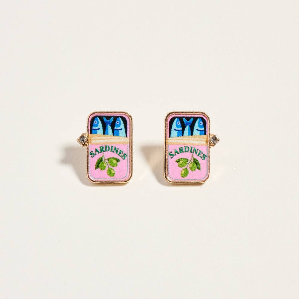 Sardine can-shaped earrings on a light beige background