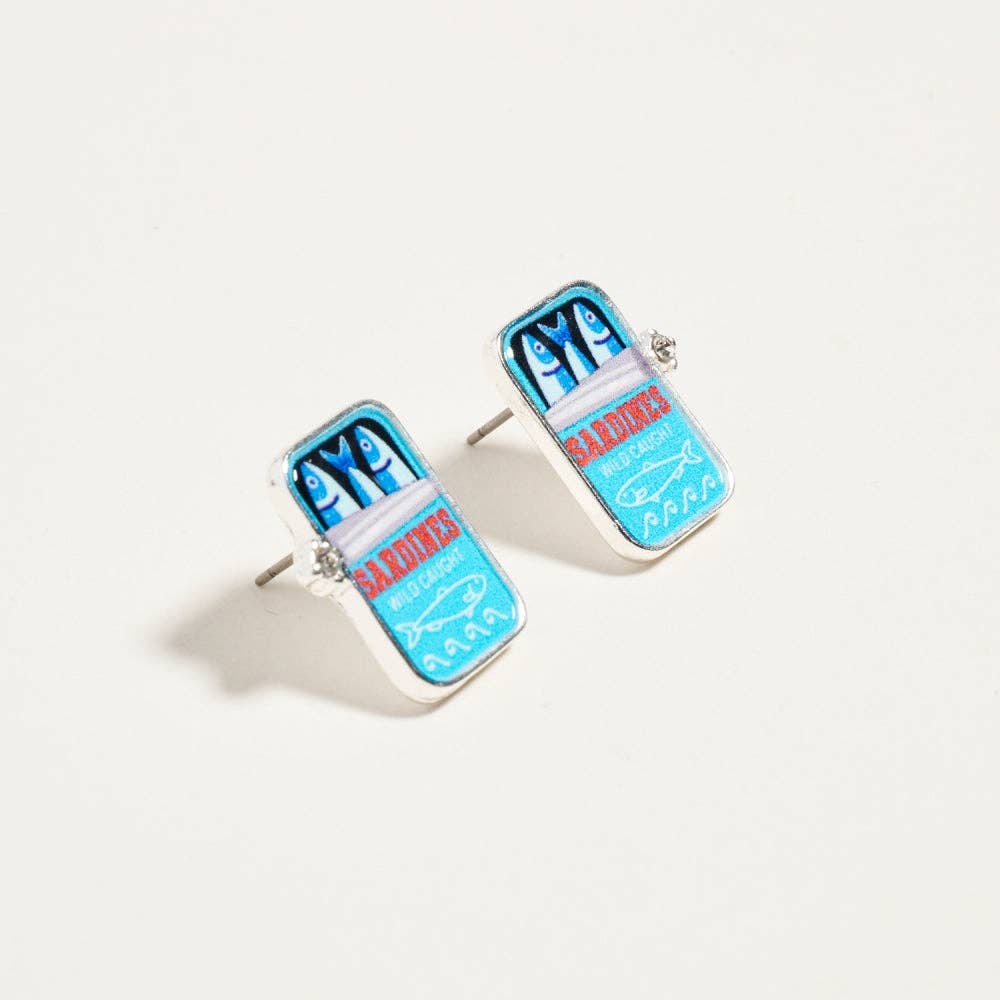 Pair of earrings with blue and red design on a white background