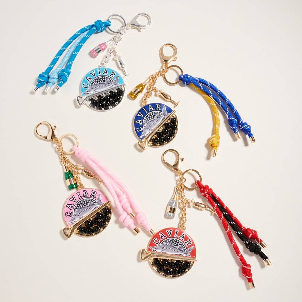 Colorful keychains with 'Caviar' branding on a light background