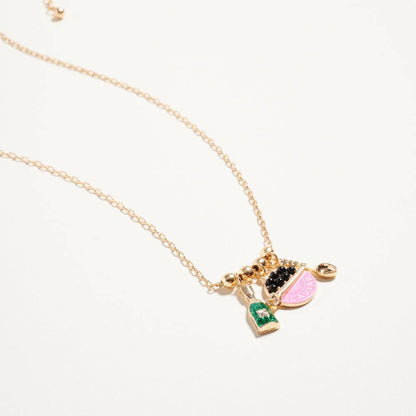 Gold necklace with colorful charms on a white background