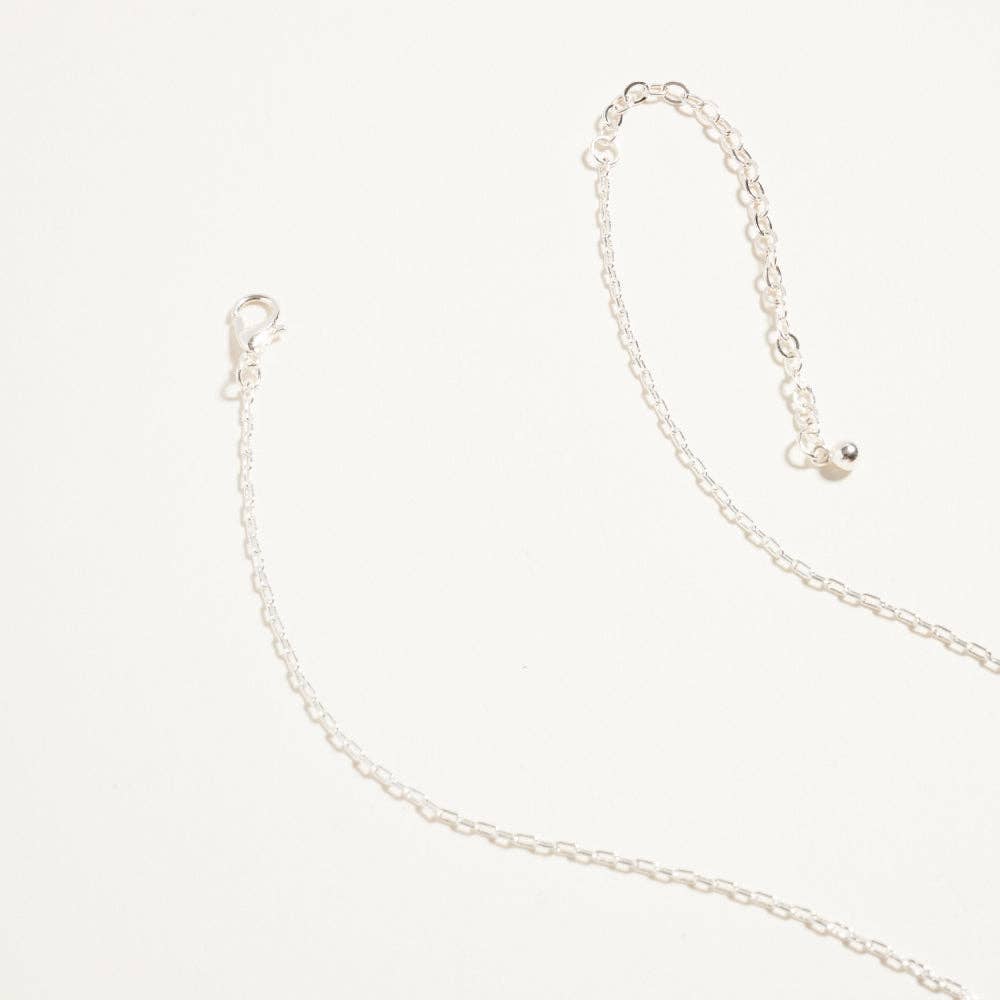 Silver chain necklace on a white background
