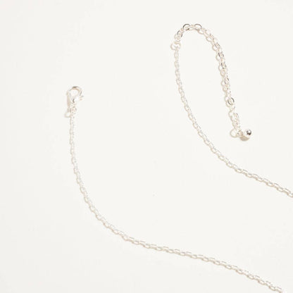 Silver chain necklace on a white background
