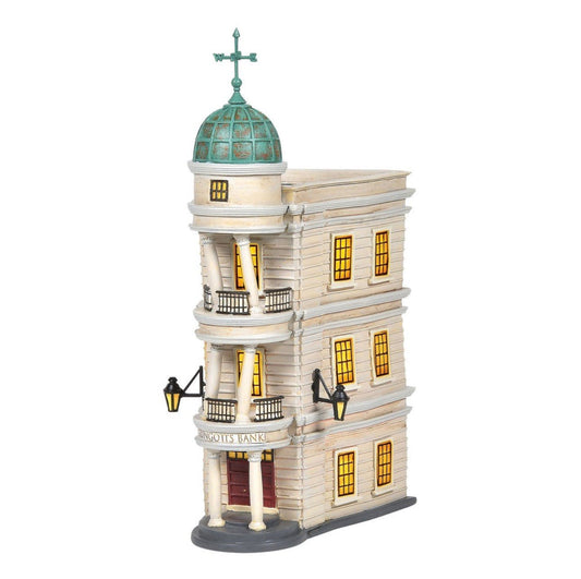 Model of a classic building with a green dome and lit windows on a white background