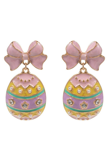 Pair of earrings with pink bows and colorful egg designs on a white background
