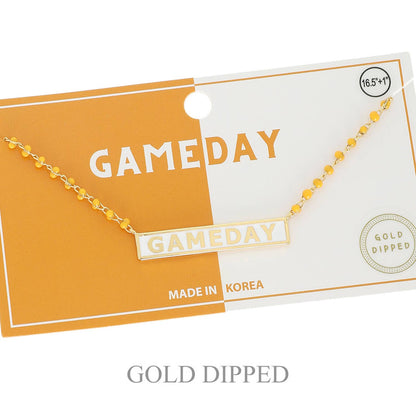 Gold-dipped 'GAMEDAY' necklace on a branded card with 'MADE IN KOREA' text.