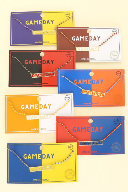 Collection of 'GAMEDAY' themed product packages in various colors on a beige background.