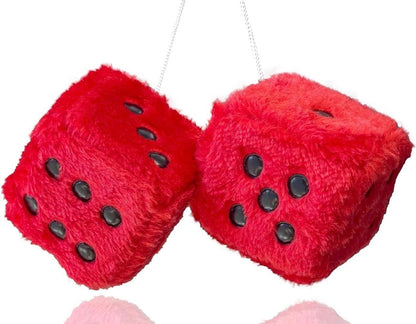Red fuzzy dice with black dots on a white background