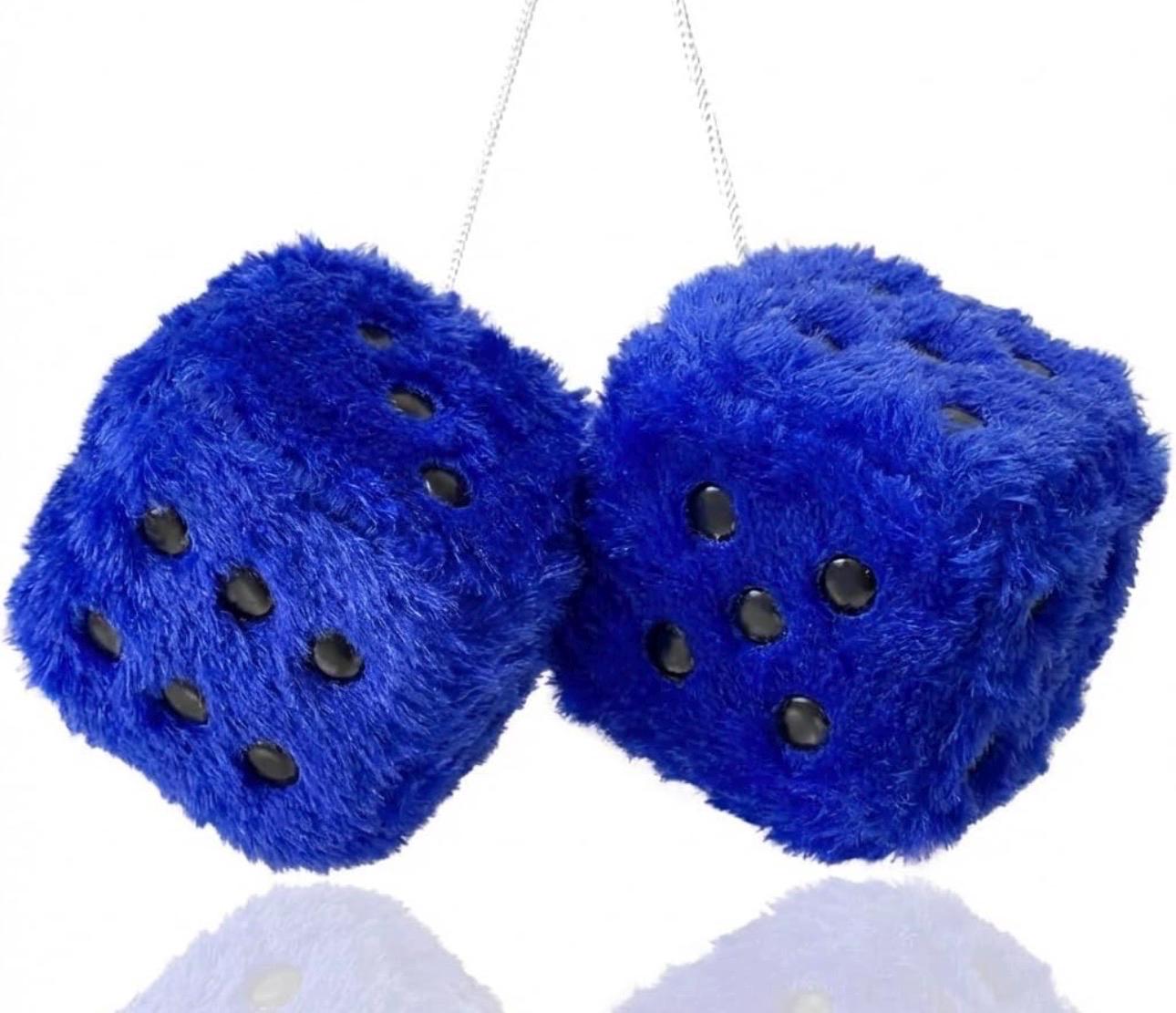 Two blue fuzzy dice with black dots on a white background