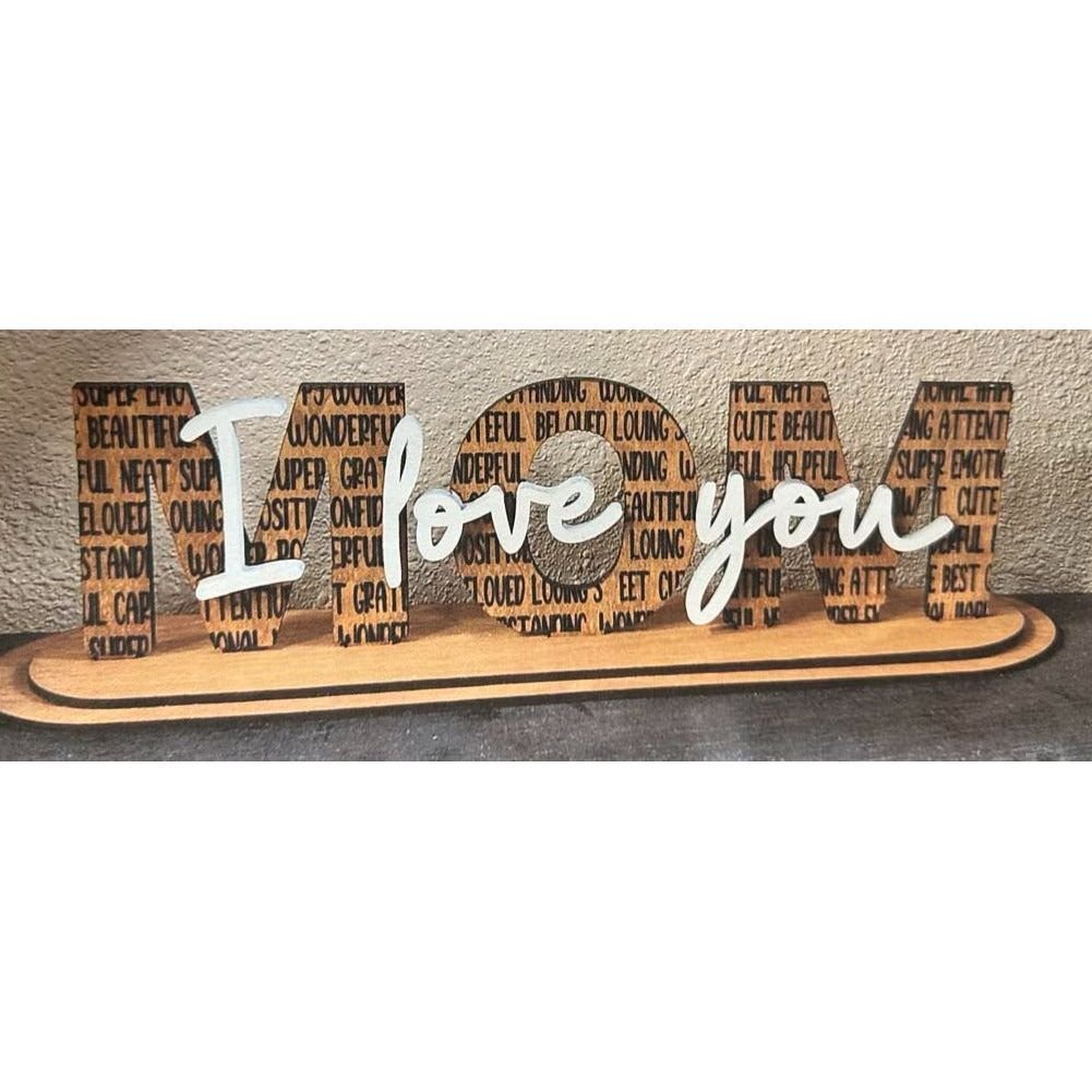Wooden decorative sign with 'I love you' text on a neutral background