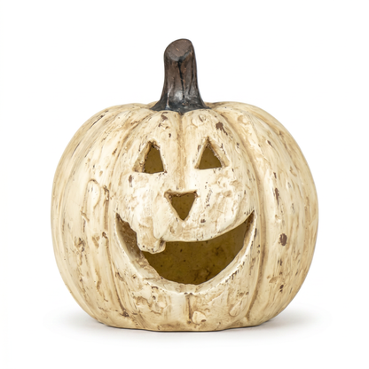 Decorative pumpkin with a carved face on a white background