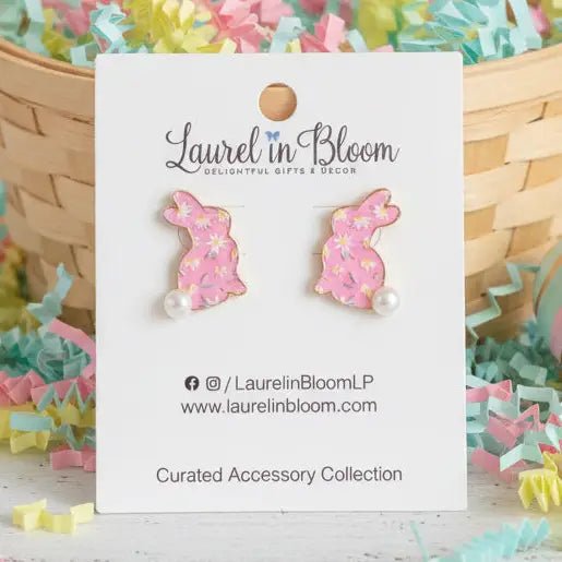Pink bunny-shaped earrings on a 'Laurel in Bloom' branded card with decorative background
