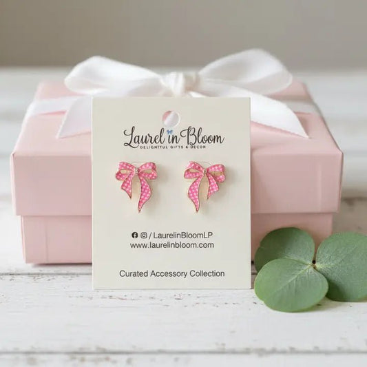 Pink bow earrings on a Laurel in Bloom card with a pink box in the background