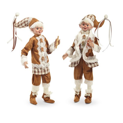 Two decorative elves in gingerbread-themed outfits on a white background