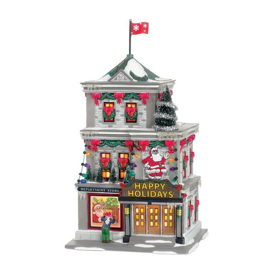 Christmas-themed miniature building with Santa Claus and festive decorations on a white background