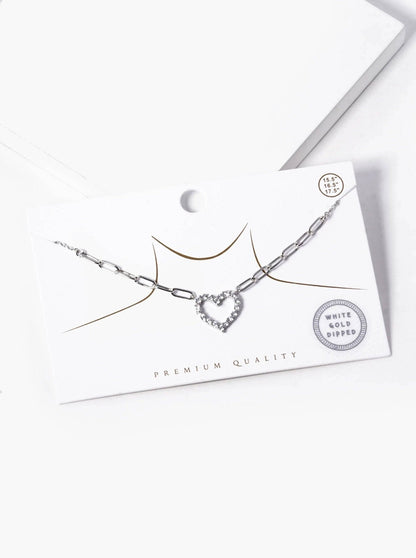 Necklace with heart-shaped pendant on a white card with 'Premium Quality' text